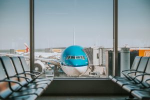 Airplane at empty gate; image by Oskar Kadaksoo, via Unsplash.com.