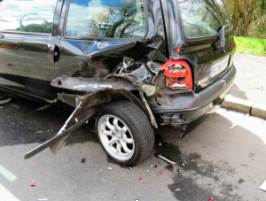 Black van with left rear damage after accident; image by Gellinger, via Pixabay.com.