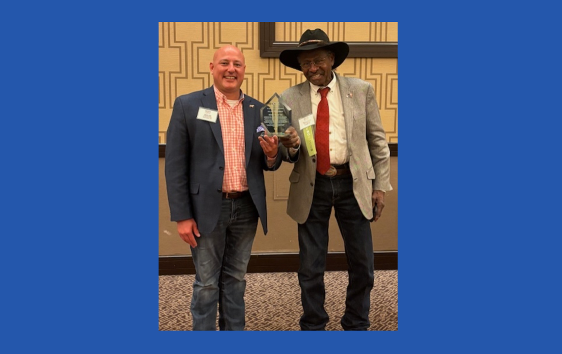 OCM President Taylor Haynes presents The Helmuth Award to Marty Irby. Photo courtesy of OCM.