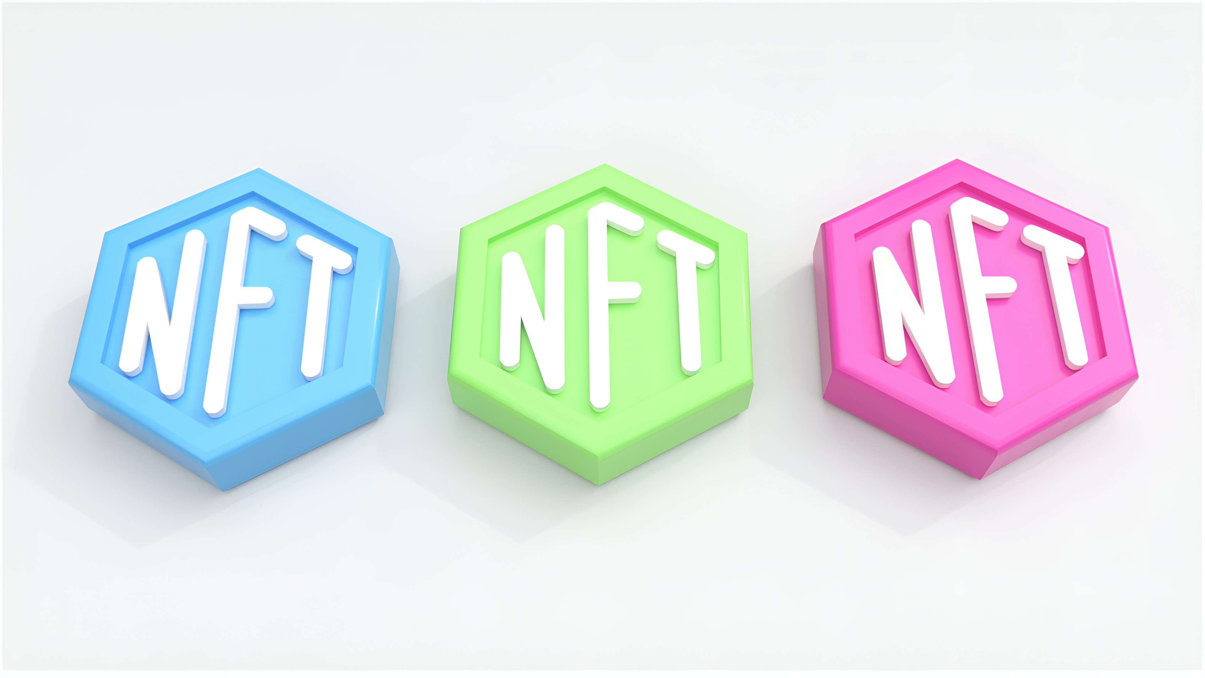 Three tokens with NFT printed on them; image by Choong Deng Xiang, via Unsplash.com.