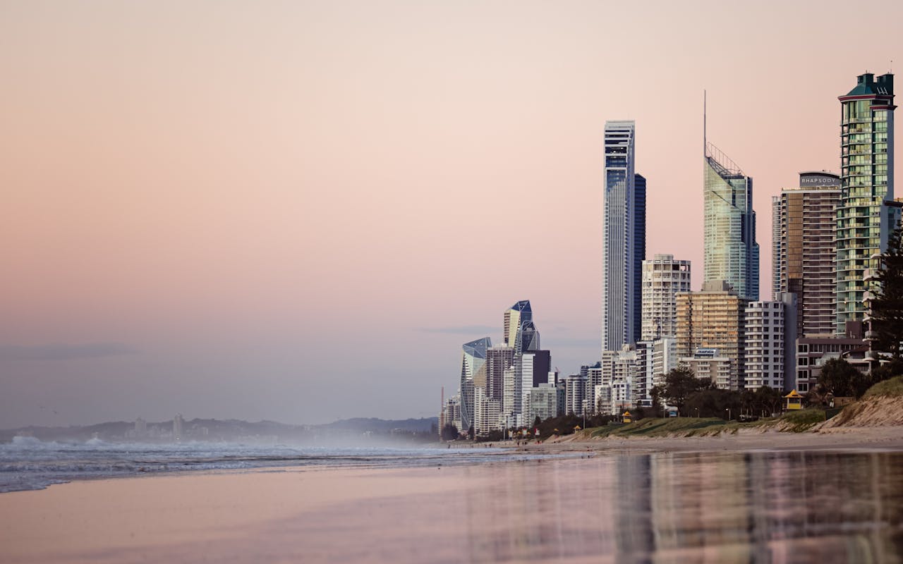 Cityscape near beach; image by Nathan Cowley, via Pexels.com.