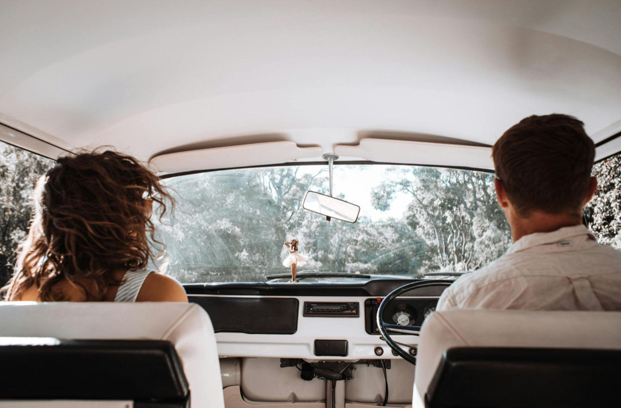 Couple traveling in vehicle; image by Rachel Claire; via Pexels.com.