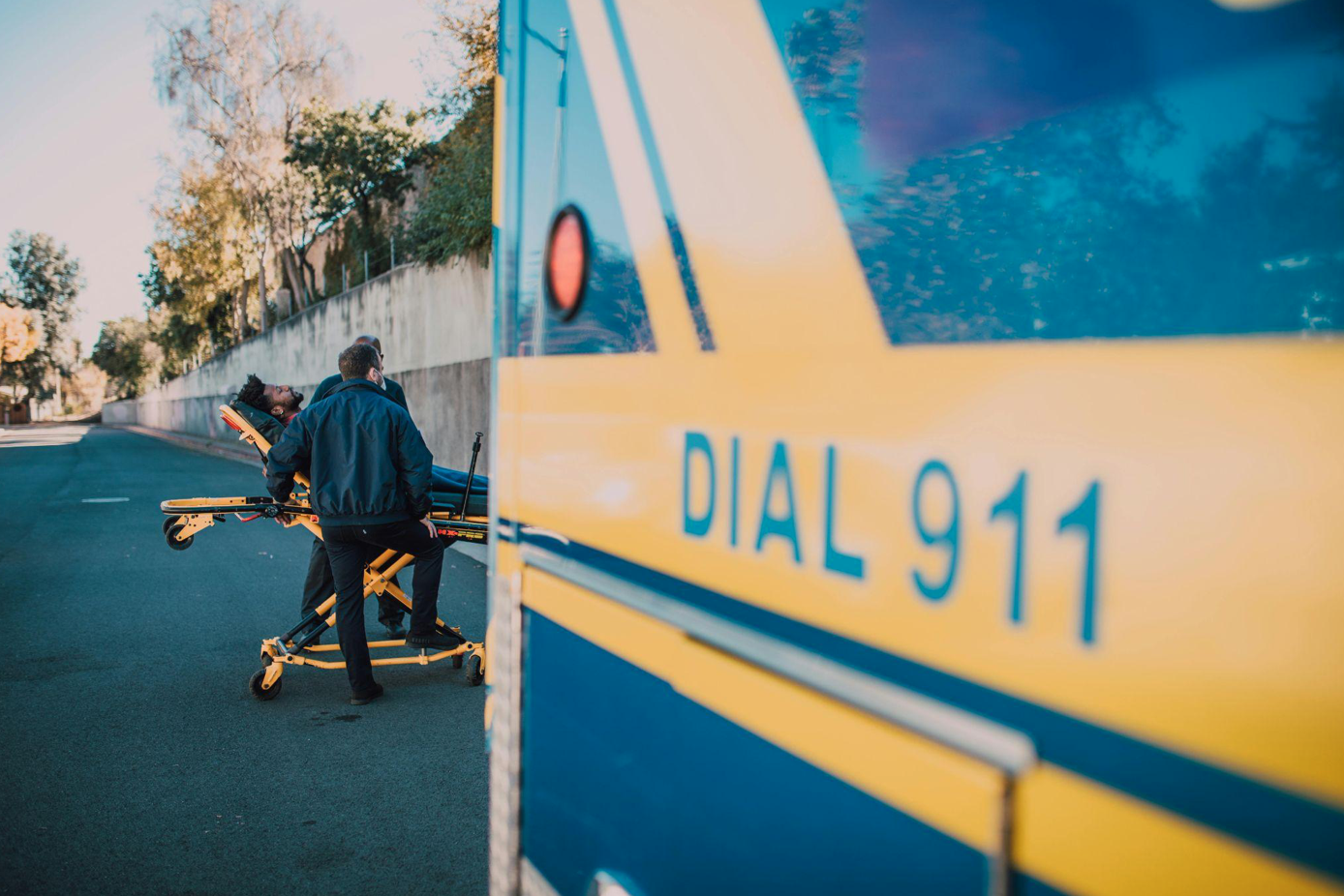 Man on a stretcher; image by RDNE Stock project, via Pexels.com.