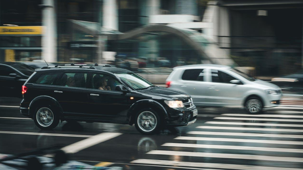 Black Suv Beside Grey Auv Crossing the Pedestrian Line during Daytime; image by Kaique Rocha, via Pexels.com.