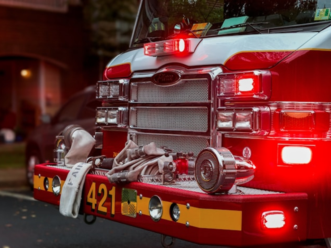 Close up shot of front of fire engine; image by Obi - @pixel9propics, via Unsplash.com.