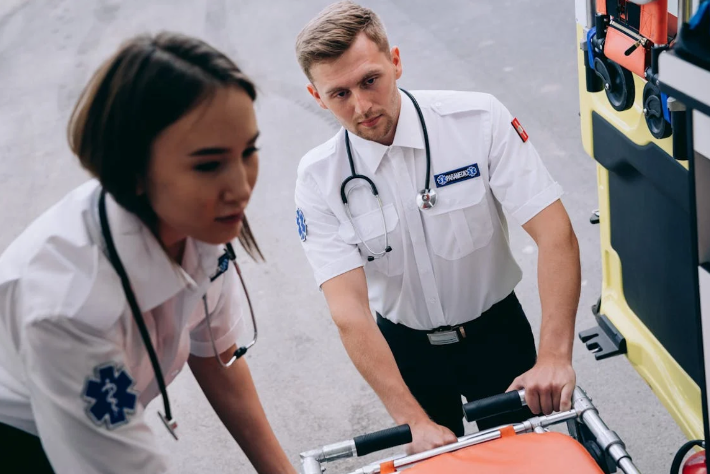 Male and female paramedic; image by Mikhail Nilov, via Pexels.com.