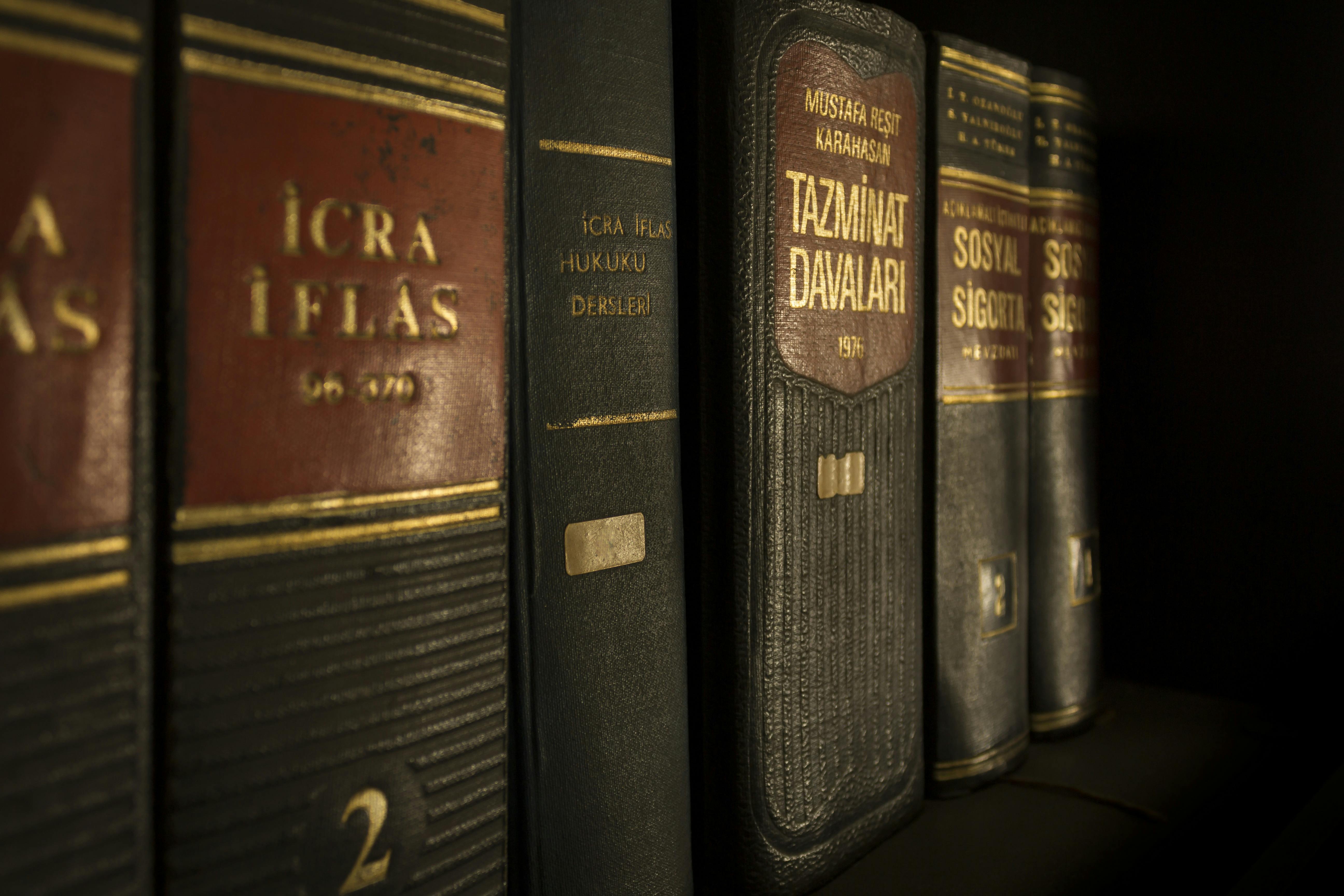 Row of old books; image by Pixabay.com, via Pexels.com.