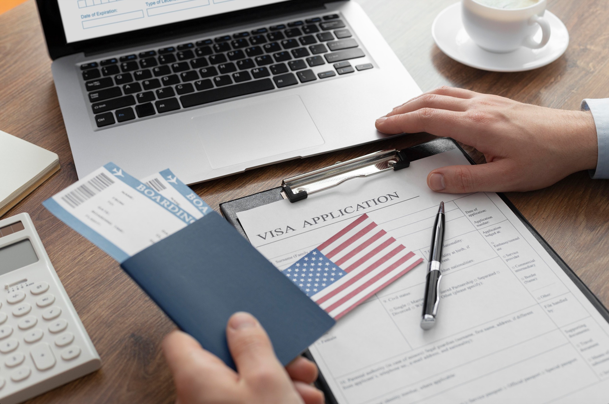 Visa application composition with American flag; image by Freepik, via Freepik.com.